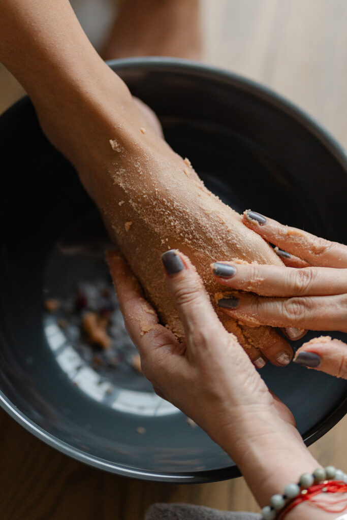 applying a soothing treatment to a client's foot during a relaxing pedicure service at Silent Moment Hair Salon